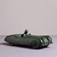 A Green Patinated Bronze Cast of a Jaguar XK120