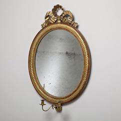 A Late 18th Century Swedish Oval Giltwood Mirror