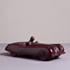 A Red Patinated Bronze Cast of a Jaguar XK120